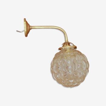 Gold metal and glass globe sconce