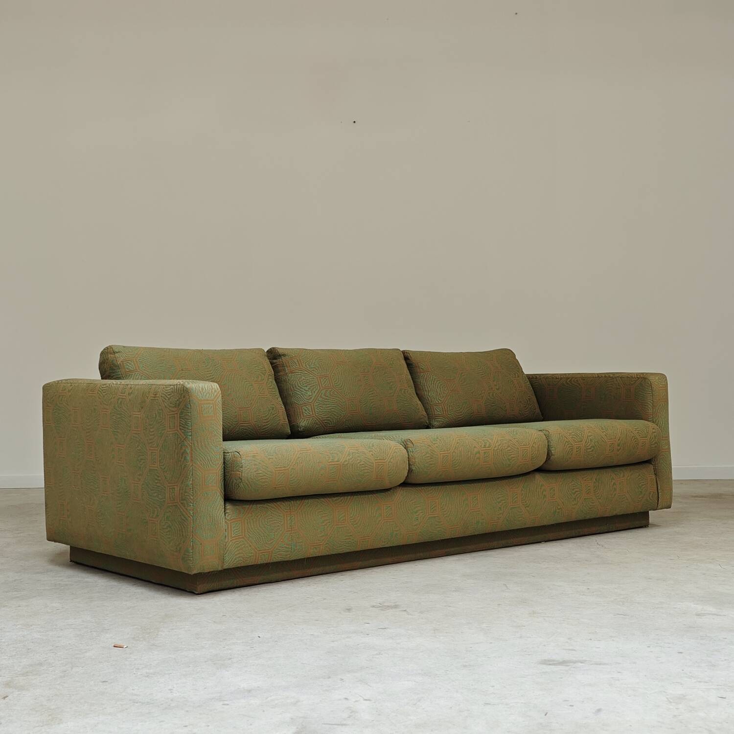 Pierre Frey modernist bench in green and gold patterned fabric