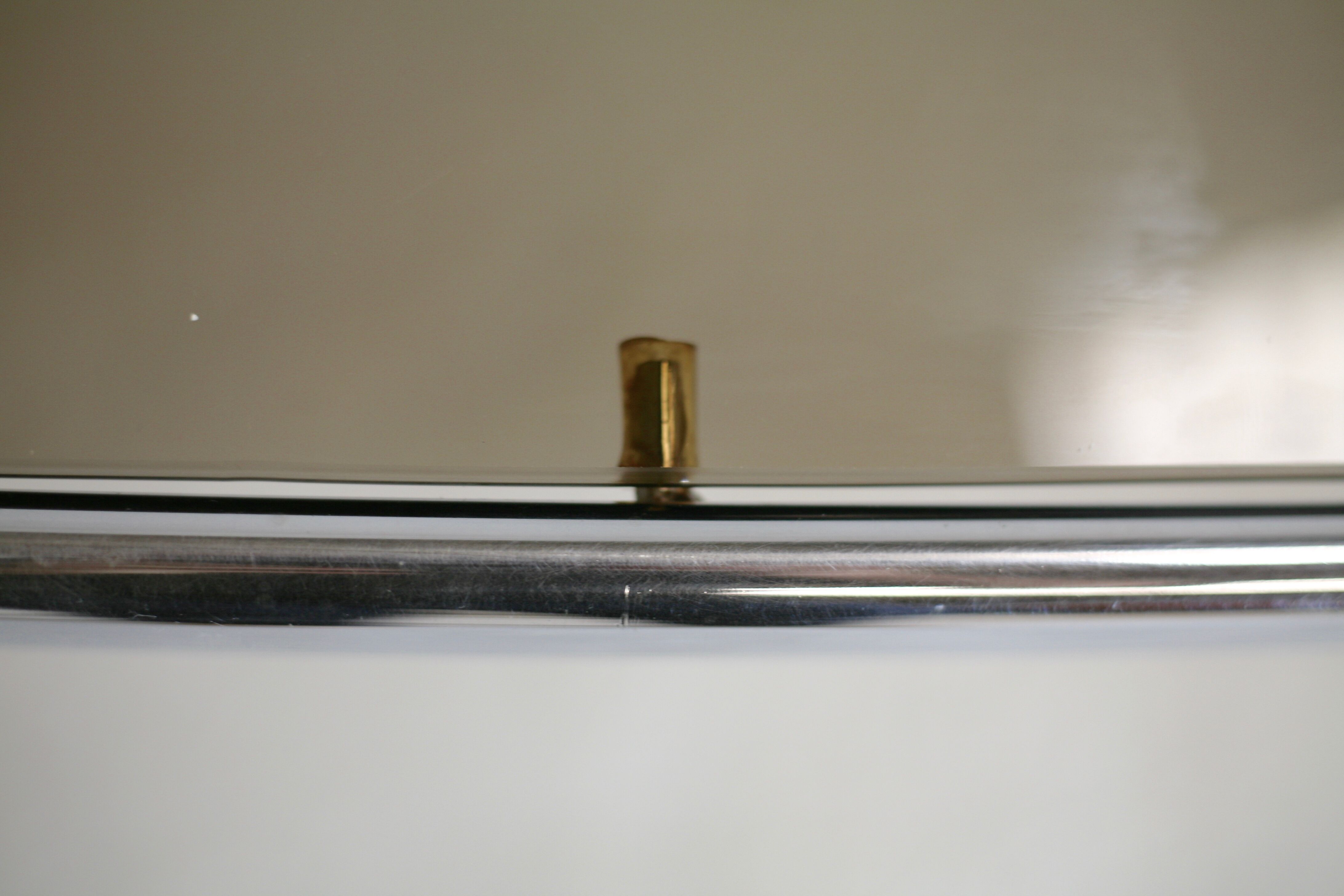 Living table. chrome metal, curved smoked glass slab, france, circa 1970.