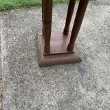 1930s Art Deco round side table in painted brown wood — column leg base