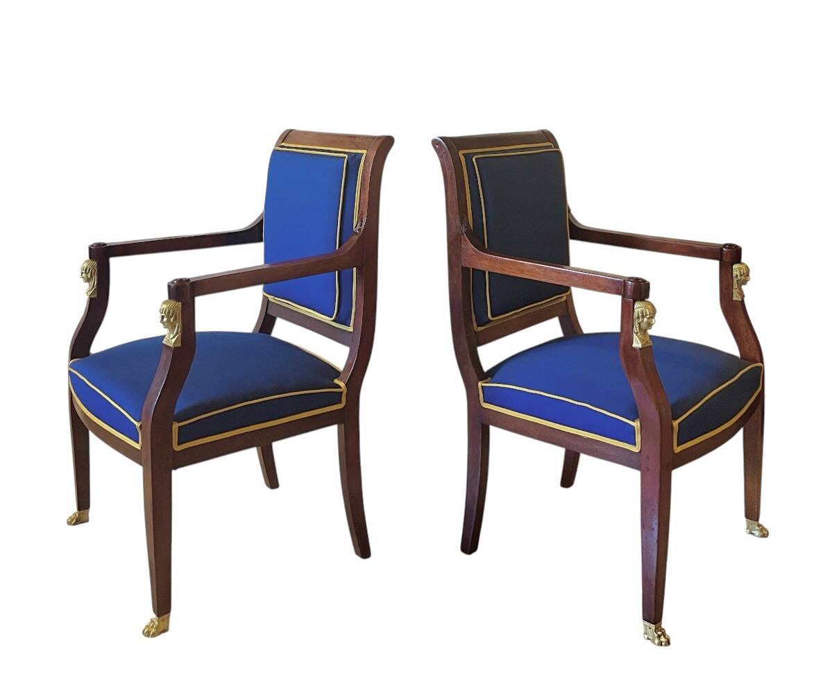 Pair of Empire style armchairs in mahogany and gilt bronze.
