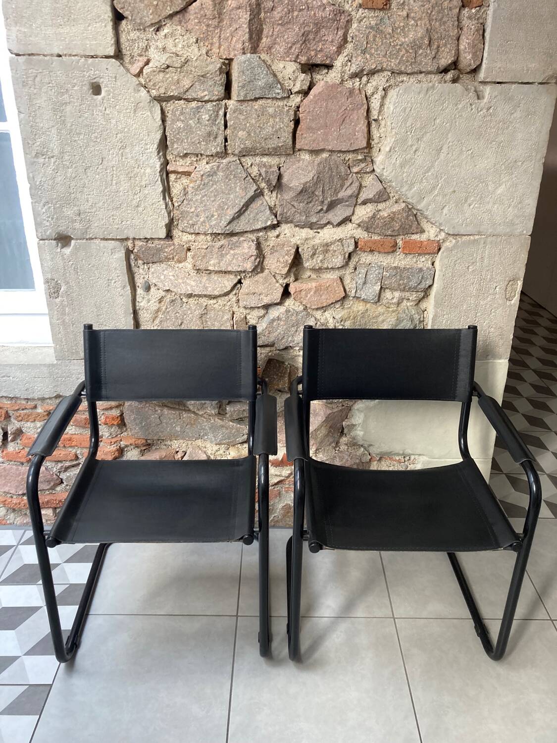 Pair of black armchairs