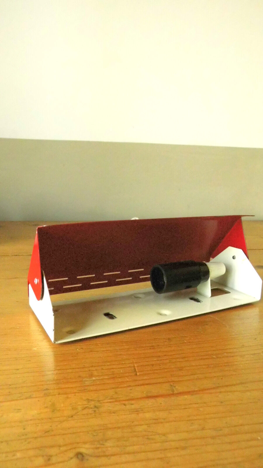 Wall lamp with red swivel shutter