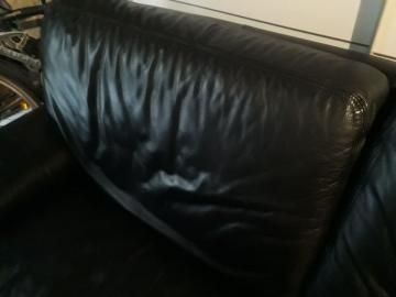 Natuzzi black leather sofa