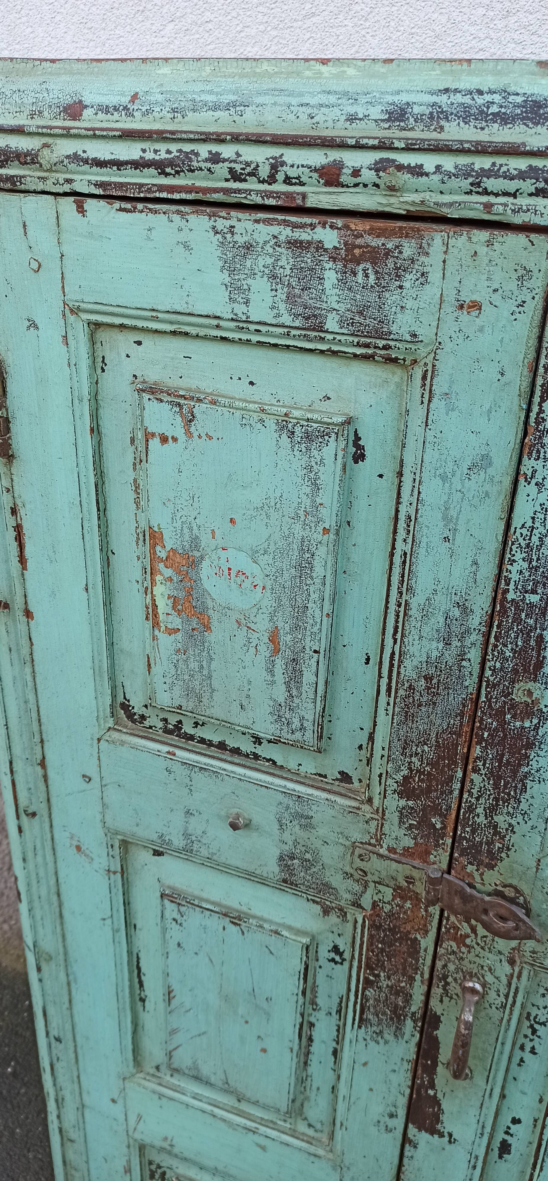 Old wooden cabinet with beautiful green patina
