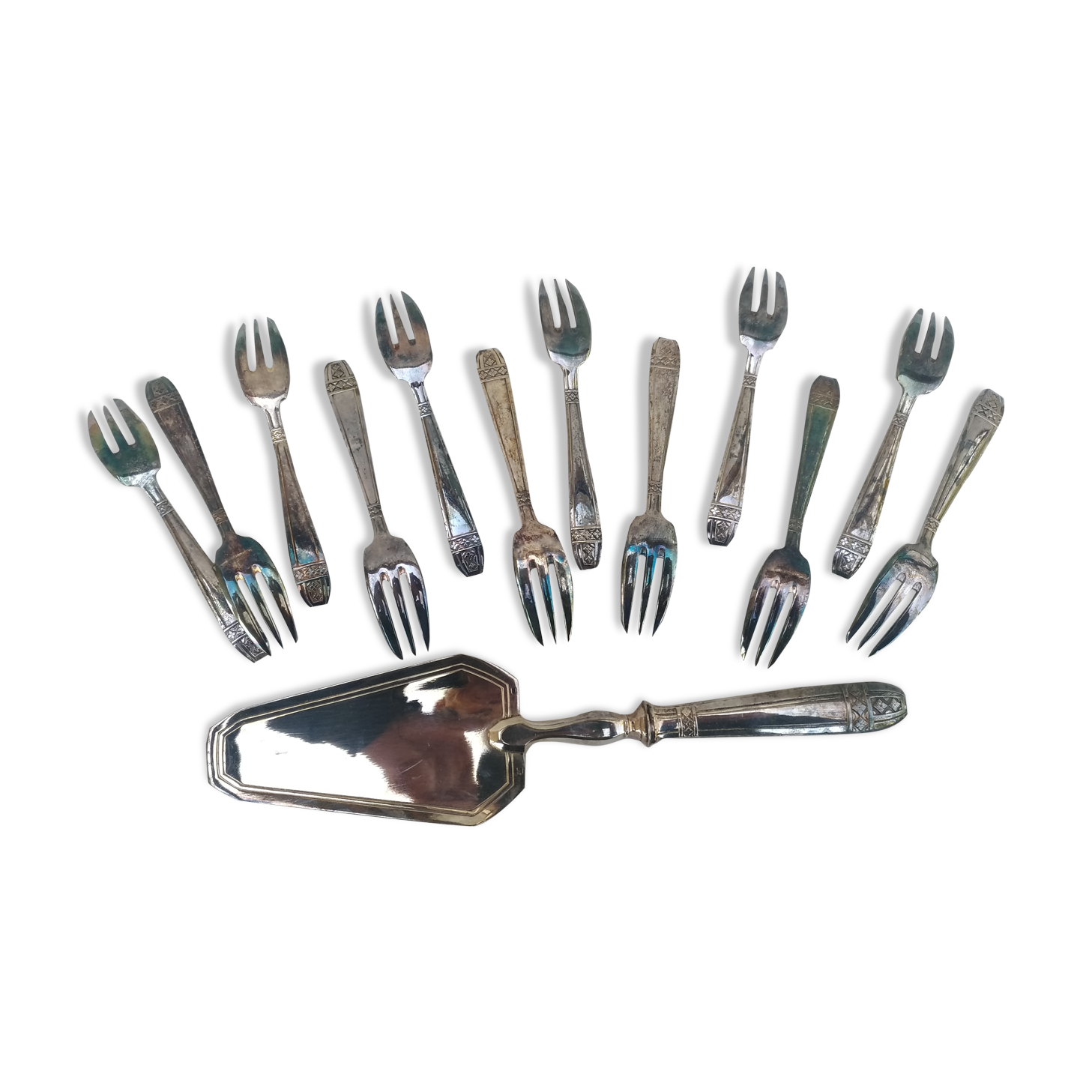 Service de fourchettes et pelle a dessert en metal argenté