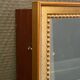 Vitrine en bois doré à suspendre .