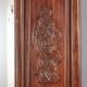 Antique mirror in exotic wood with chinoiserie carvings, 19th century.