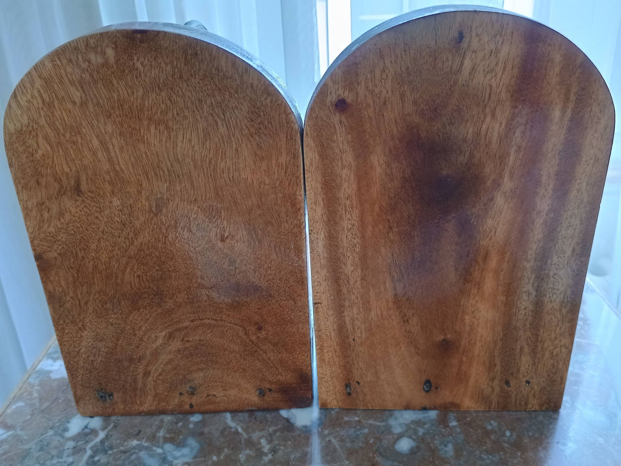 Pair of vintage bookends with rotating terrestrial globes on wooden bases in Spain
