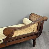 Louis XVI style meridian in carved wood and caning, 19th century.