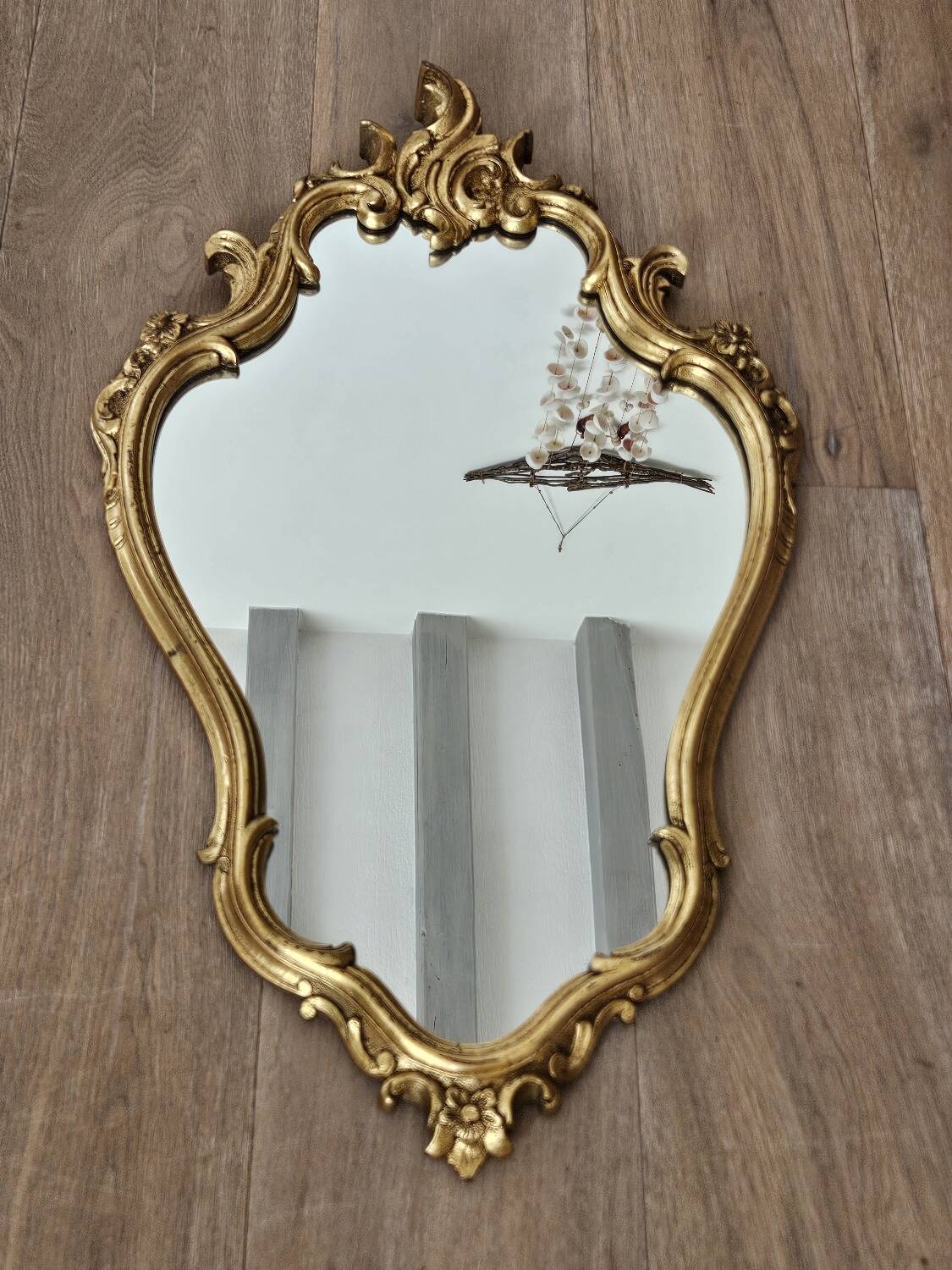 Rockery mirror under gilded frame