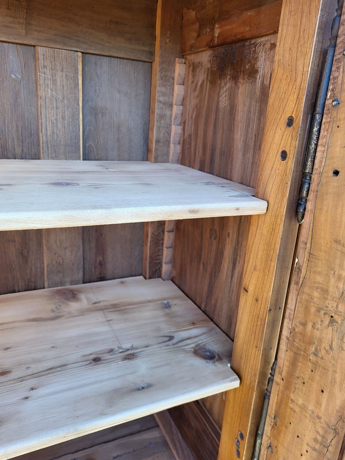 Furniture with a cherry wood door.