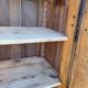 Furniture with a cherry wood door.