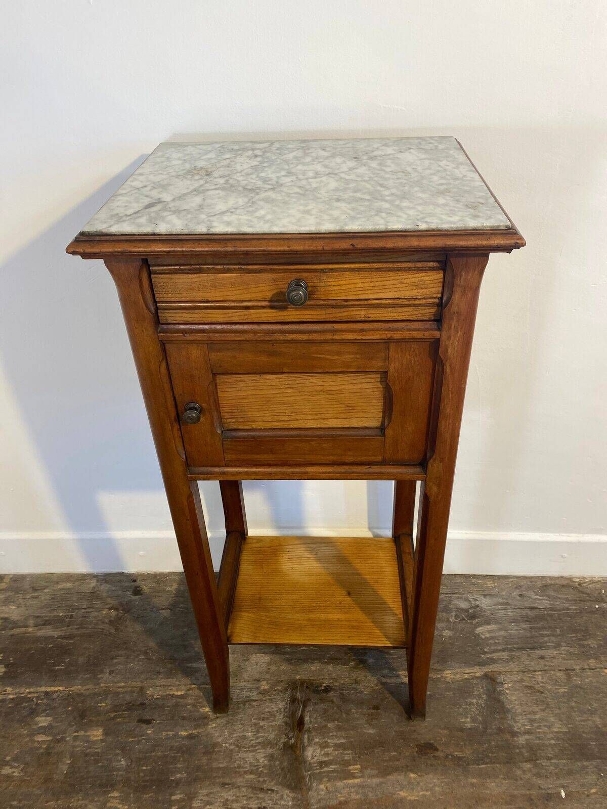 Provincial oak furniture, marble top, ceramic interior.