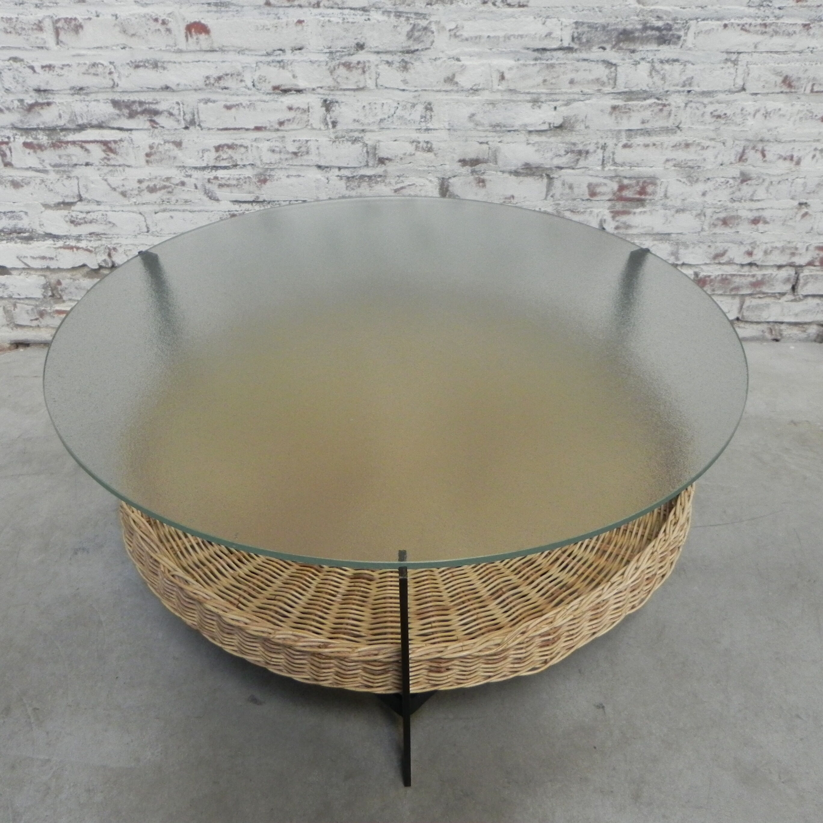 Vintage coffee table with glass top and rattan basket