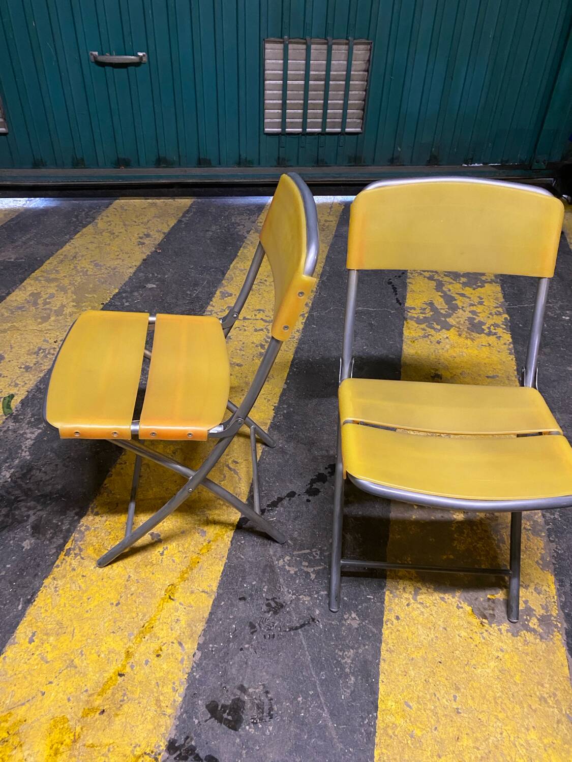 Yellow plastic and steel folding chairs, 1970s