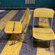 Yellow plastic and steel folding chairs, 1970s