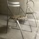 Pair of folding chairs from the 80s with leopard print seats.