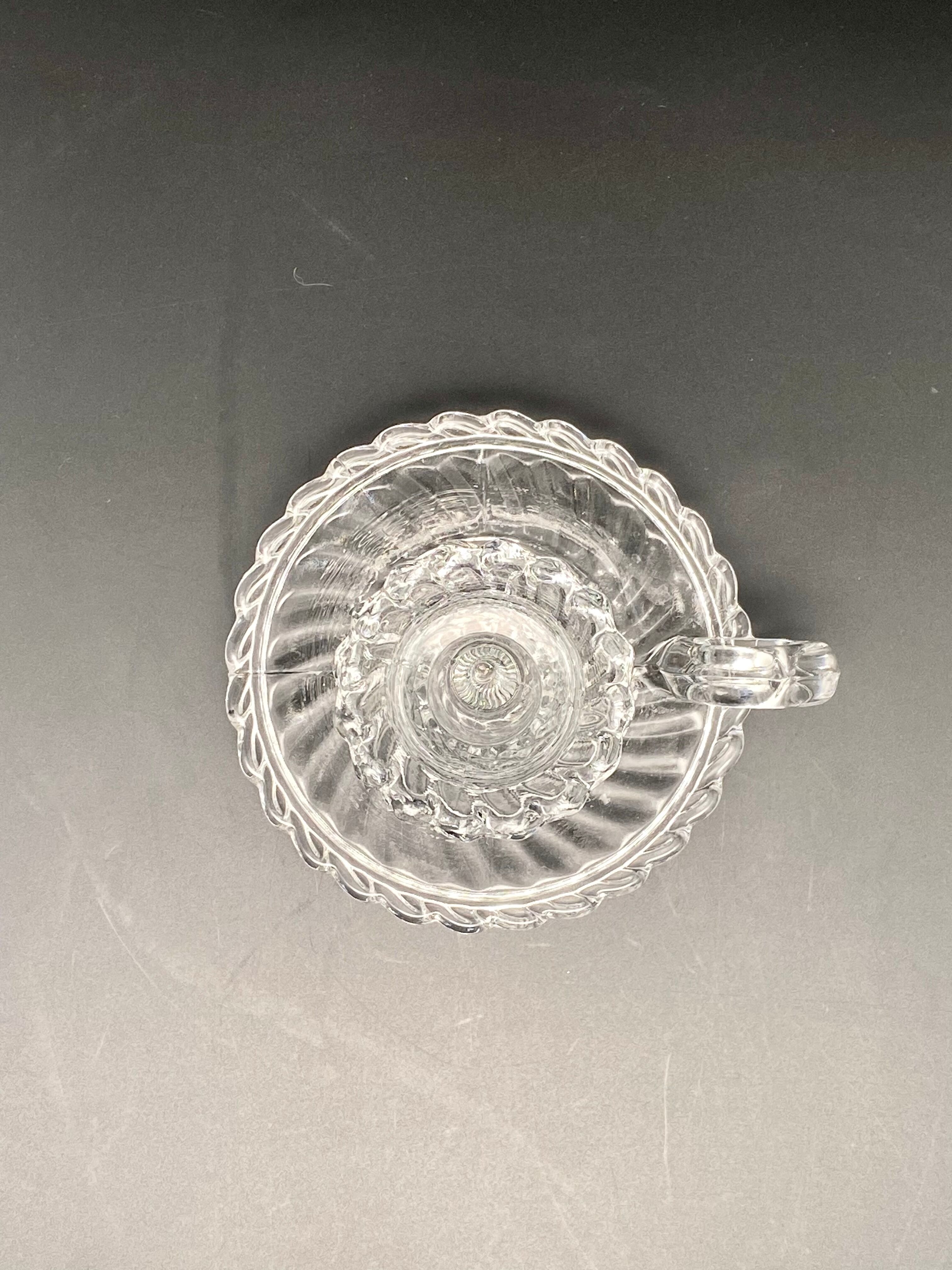 Candle holder with cup and handle in worked glass