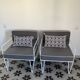 Vintage white metal Croisette style armchairs with hairpin legs in superb condition