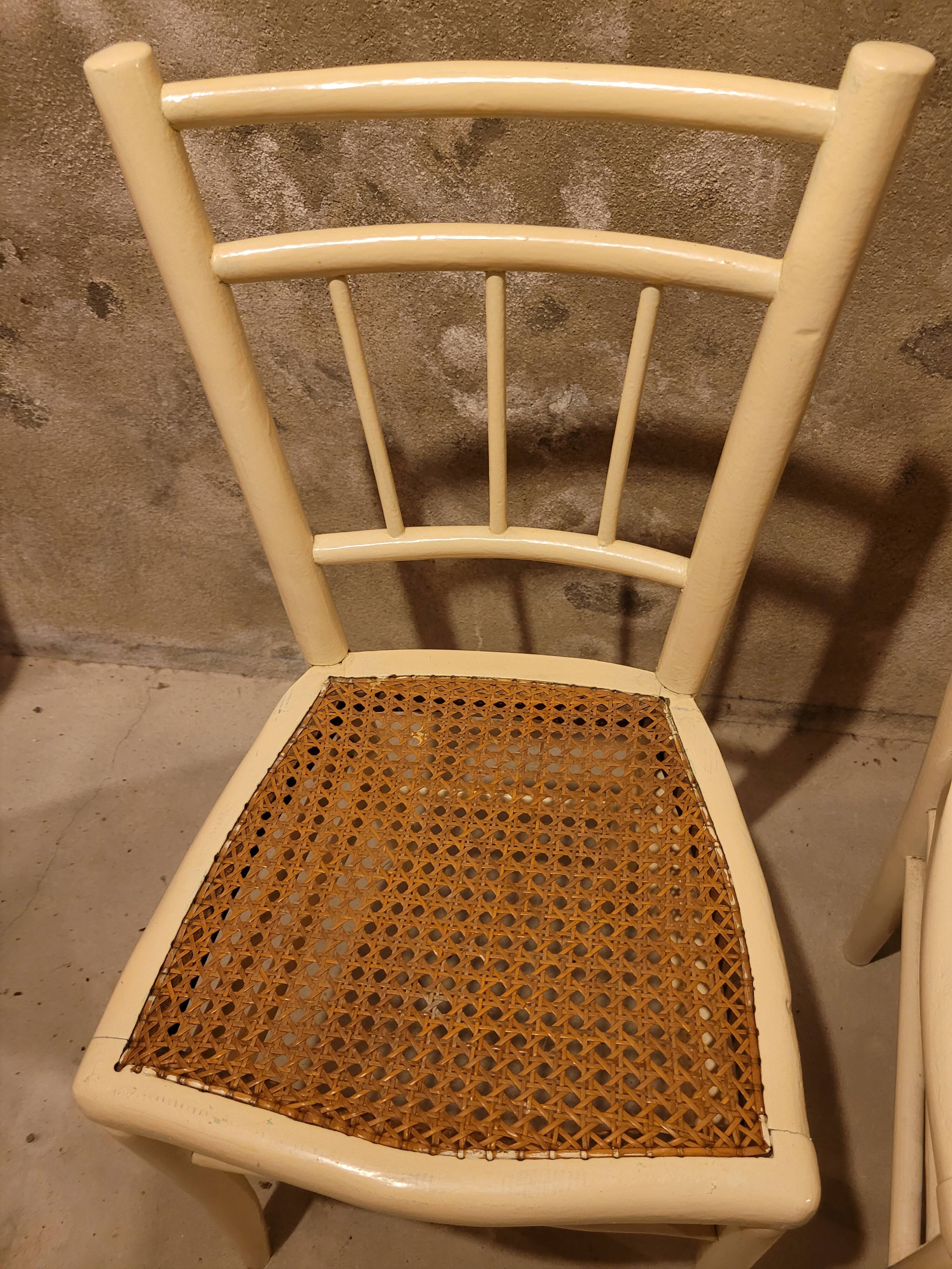 2 white wooden chairs