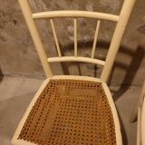 2 white wooden chairs