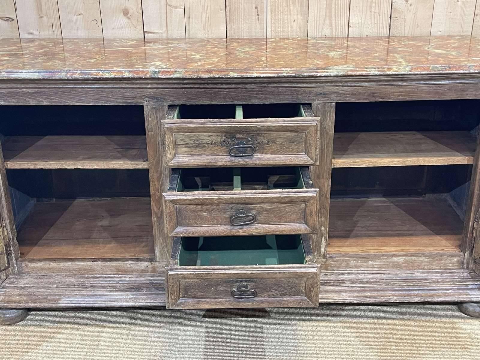 18th-century oak enfilade with a marble-effect painted top.