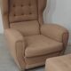Beige wingback armchair and TVAR footrest, former Czechoslovakia.