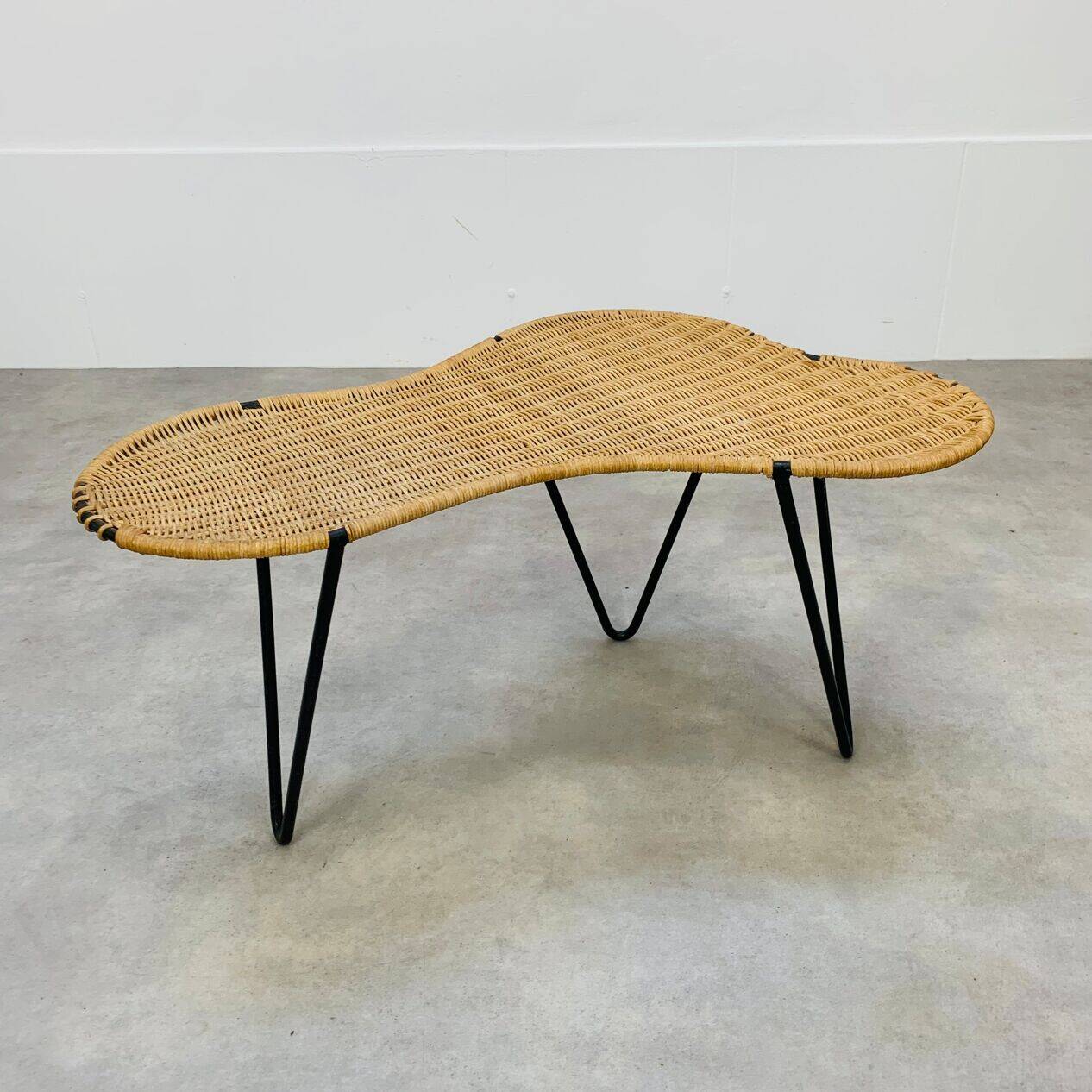 Raoul Guys coffee table, free form, wicker and metal, 1960s.