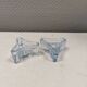 Two beautiful glass candle holders in translucent bluish glass.