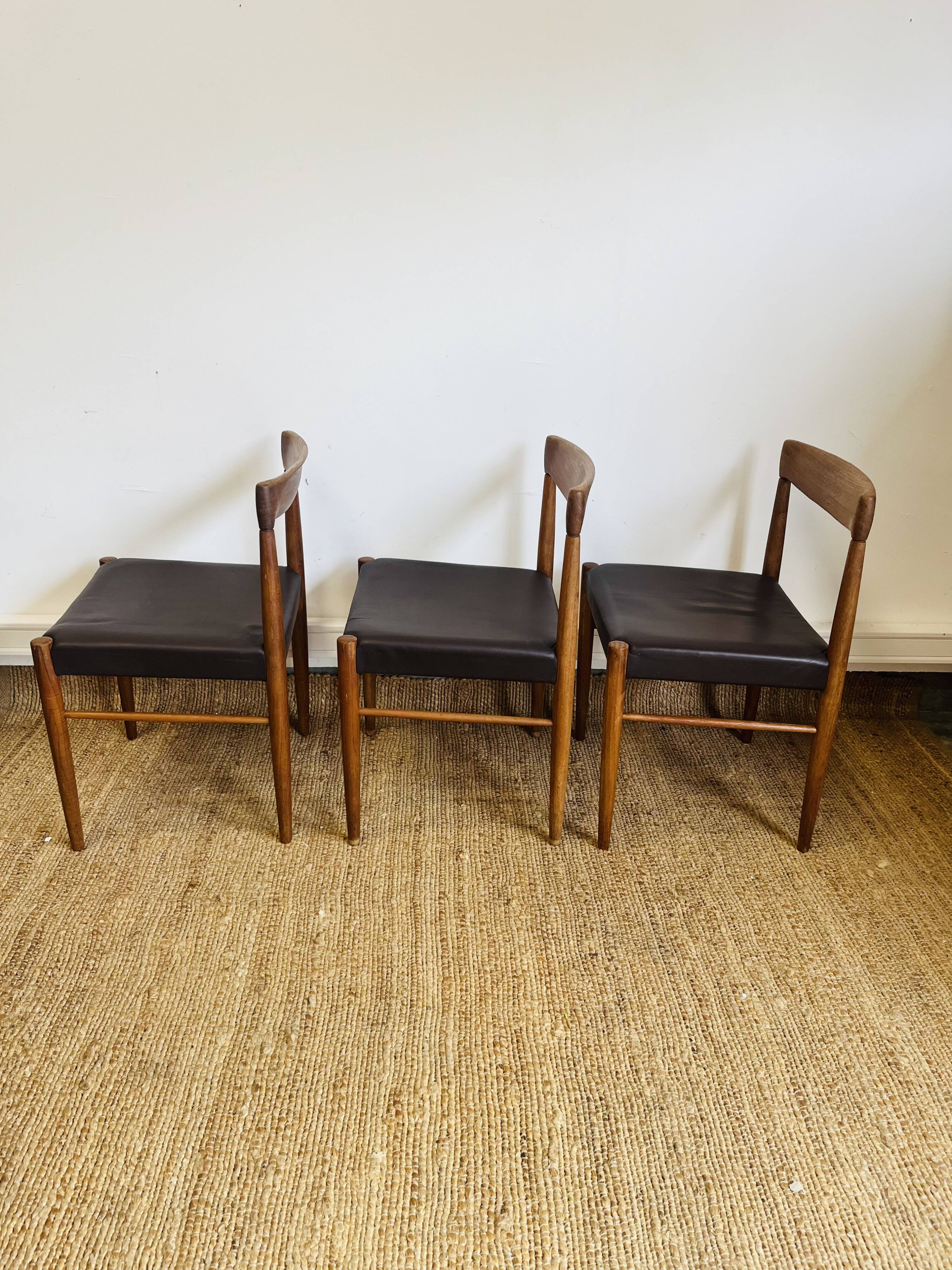 3 vintage Scandinavian chairs in teak and brown leatherette