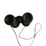 Old brass binoculars with integrated compass