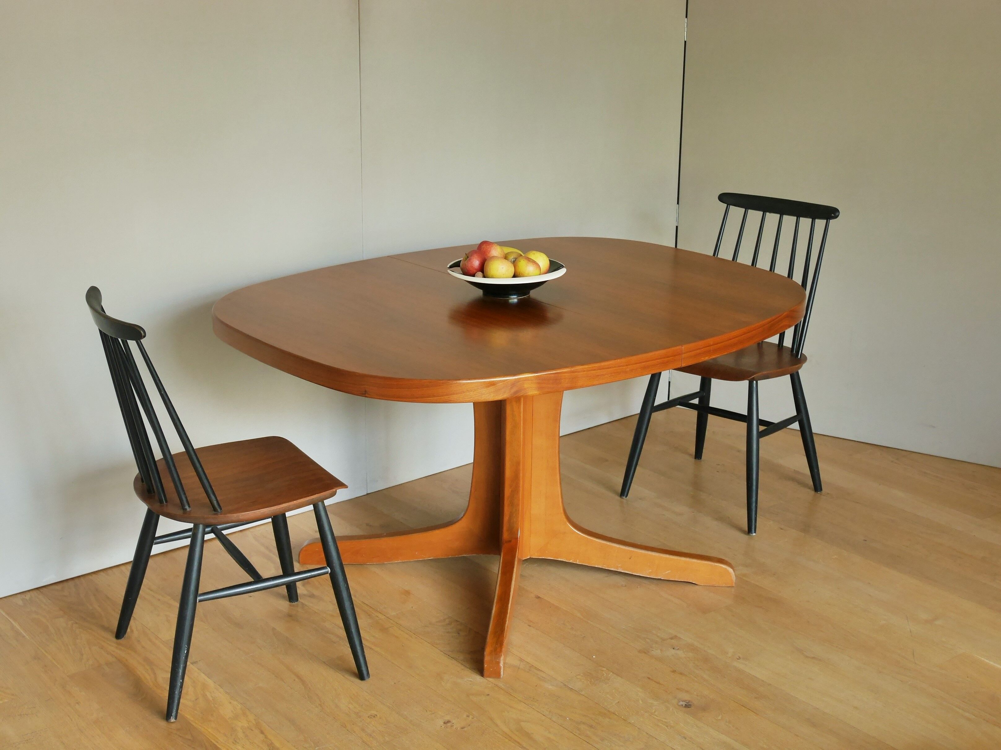 Baumann oval walnut table with extension cords