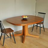 Baumann oval walnut table with extension cords