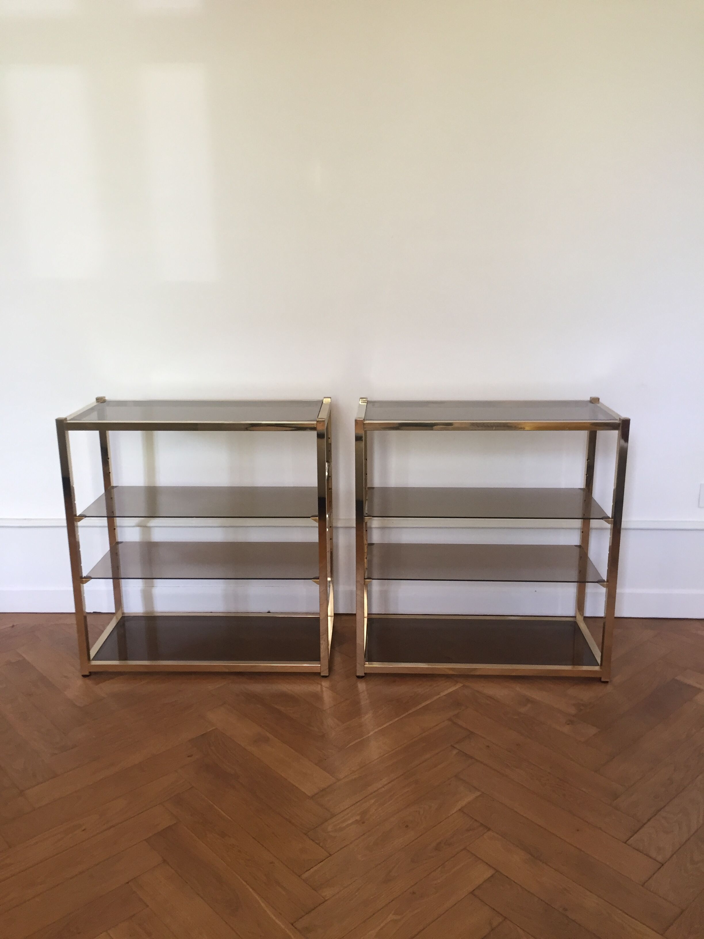 Pair of consoles brass shelves and smoked glass design Roche Bobois