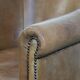 Characterful club chair made of sheepskin leather with light cognac colours