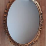 Miroir mural ovale en bois doré