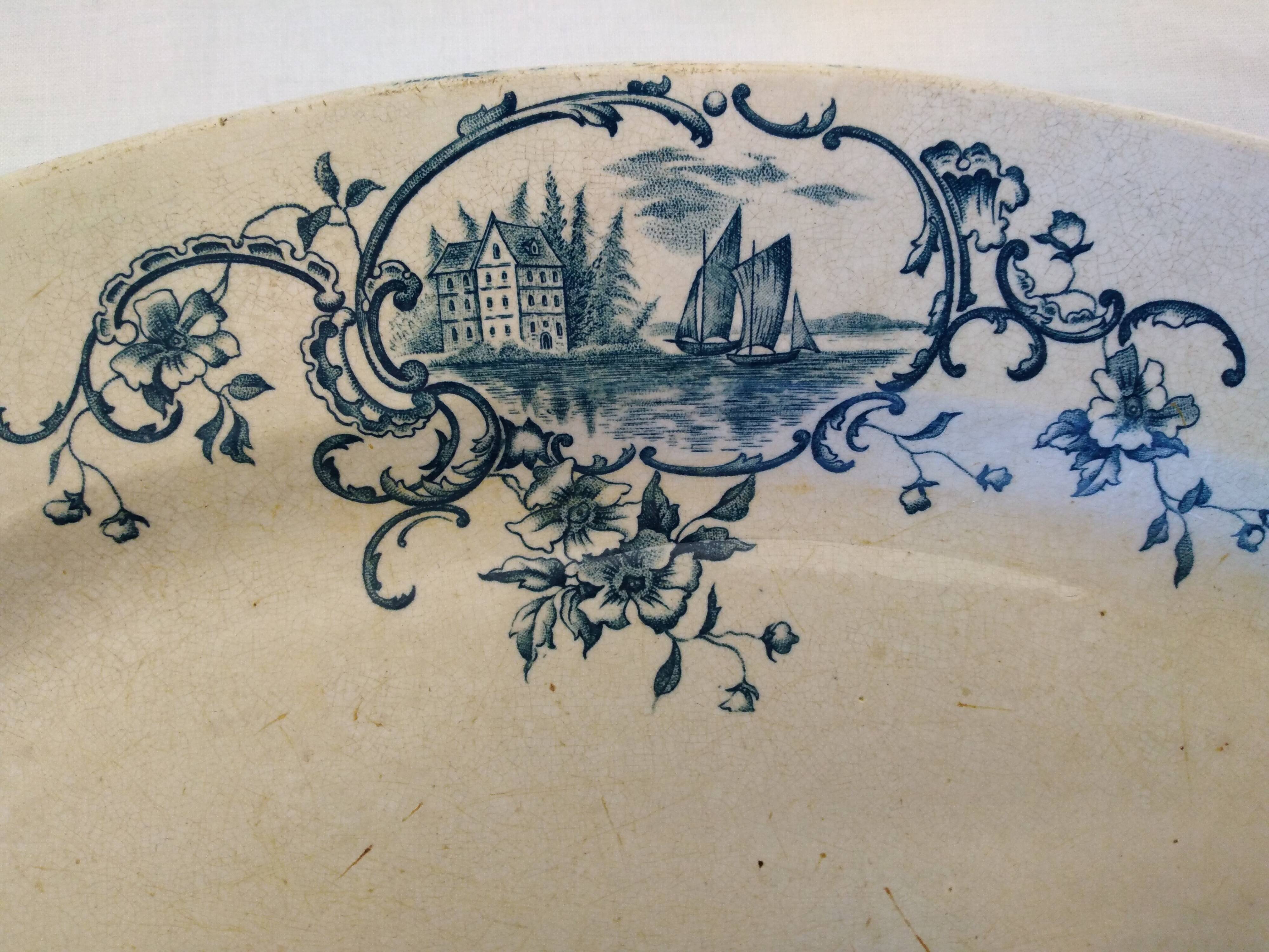 Old serving dish floral and maritime decoration