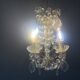 Small antique chandelier with tassels and bronze from the early 20th century