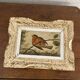 Vintage frame bird painting on a branch