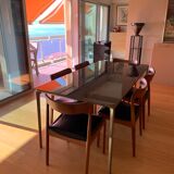 Suite of 6 chairs in solid teak and black skai