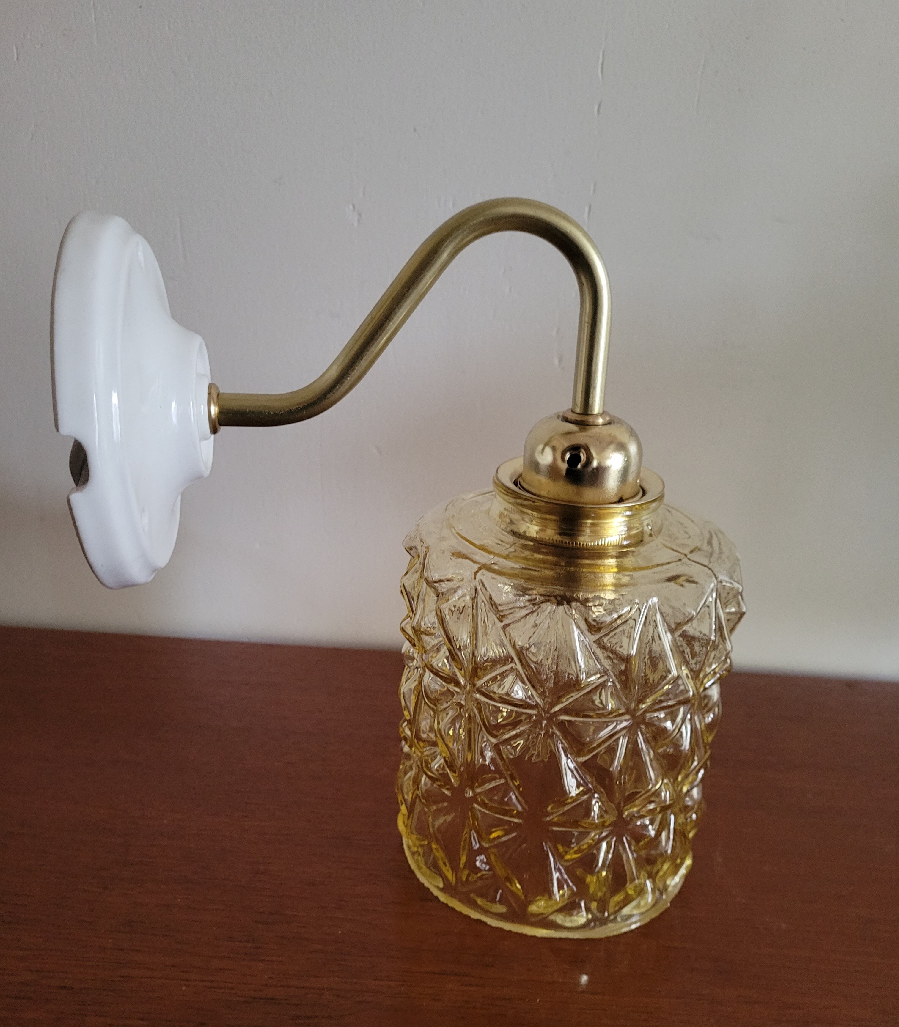 Brass wall lamp and molded glass