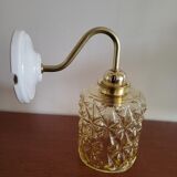 Brass wall lamp and molded glass