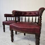 Pair of barrel chairs in turned wood and burgundy leather – Productio