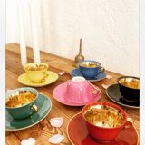 Set of colorful porcelain cups and cups