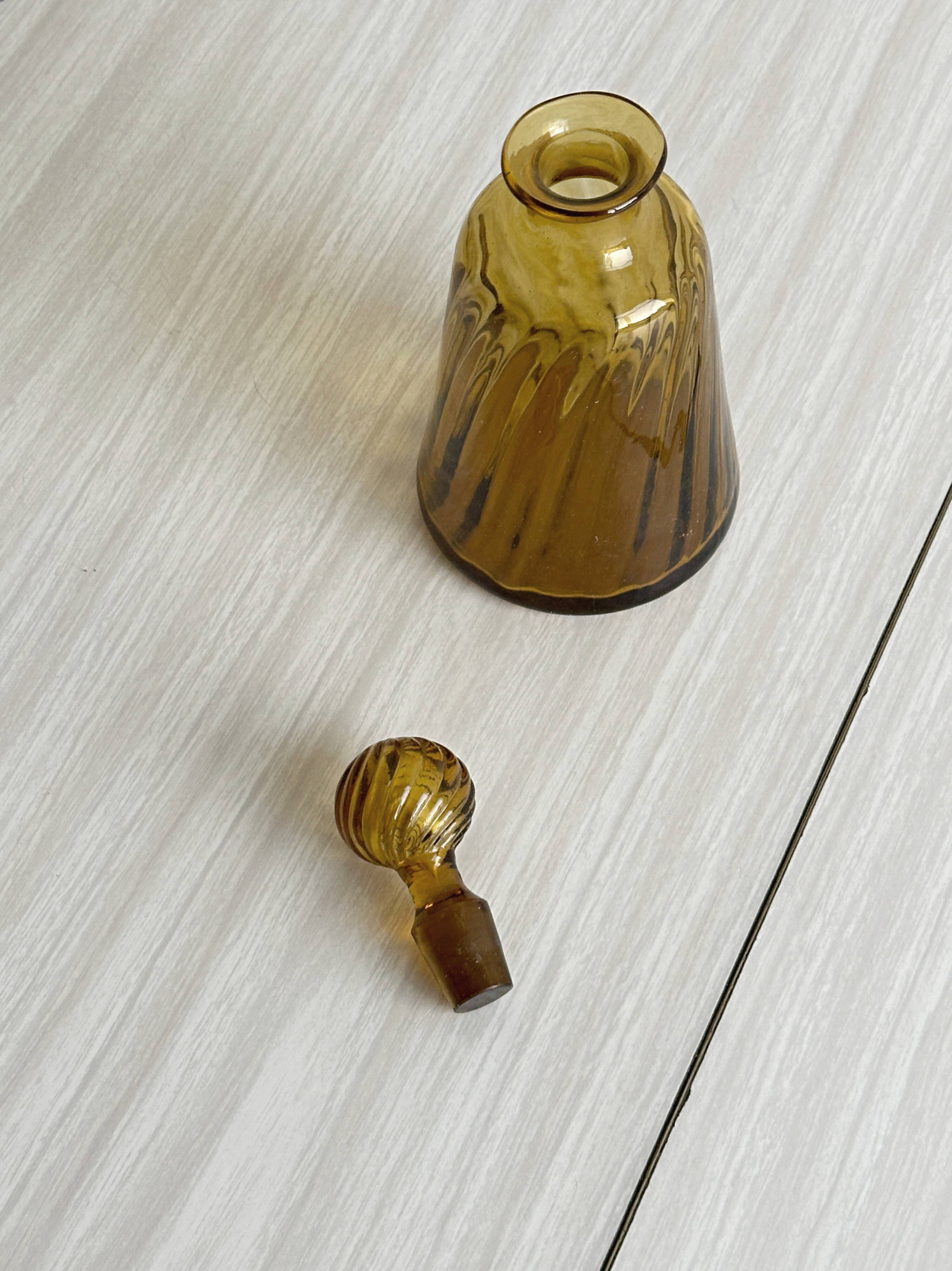 Twisted amber glass carafe