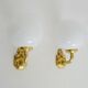 Pair of wall sconces with carp fish, brass and opaline globe.