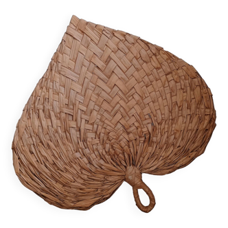 Heart fan in vintage woven palm leaves