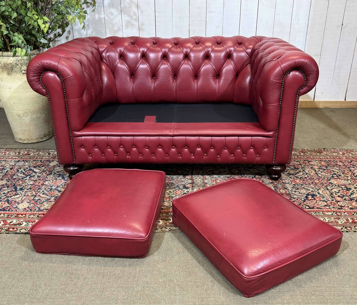 Chesterfield 2-seater leather sofa, modern production from the 2000s.
