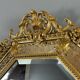 Antique octagonal mirror in richly carved gilded wood, Louis XV style.